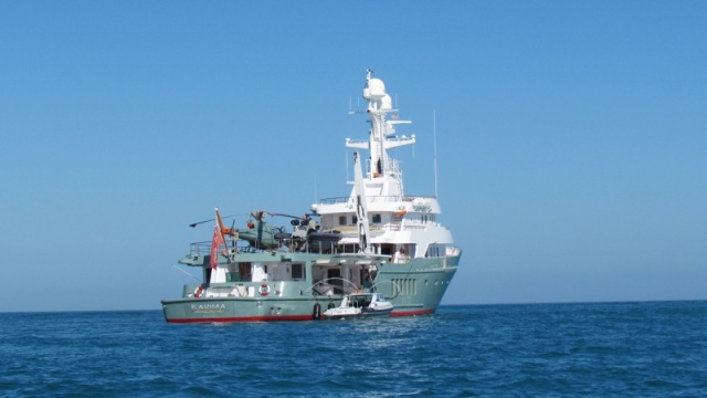 Check out this Yacht anchored just outside Key WEst Harbor, I think I see a helicopter and a ultra sized hard bottom inflatable. A pretty sturdy looking deck crane to boot.