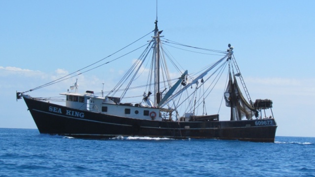 Heading out the main shipping channel through the edge of the reef this boat on the way in