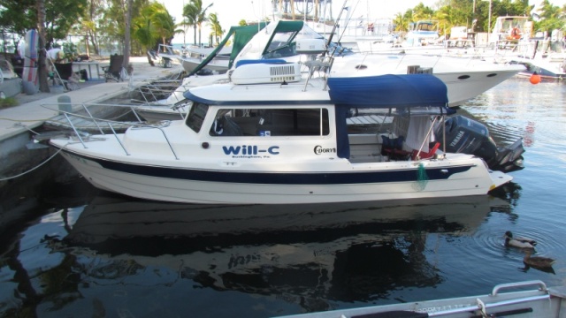 fixed docks the length of the boat but only about a foot of tide easy on and off.