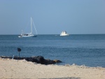 Photo taken from Black Fin's beach area. Seems to  be an anchorage. I'm not sure if they can dink in here for showers etc at the Black Fin marina or not. They have steps go into water,the rea is all lit up at night with LED lights looks pretty festive. Tables chairs and barbecue out here, short walk from our slip