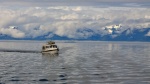 Our little boat seems so small on these big Alaska waters.