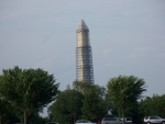 Washington Monument, being repaired due to earth quake, viewed from Potomac River