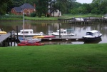 OSPREY's dock hosting some of the cruising gang's boats. The 
'black' hulled boat, 'River Horse' to the right took abt 11 years to be built. The CD25 is 'Skimmer' and the CD22 is 'Pandy Girl'.