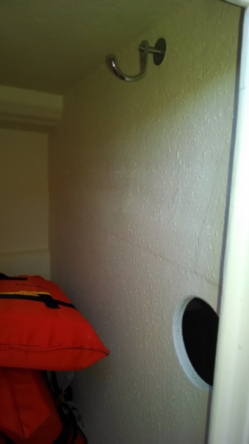 Hole cut between locker & hot water compt allows air flow to stop mildew.