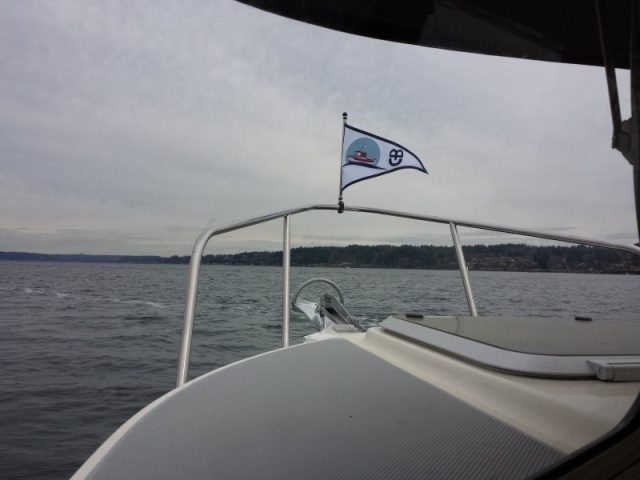 Off to our first night on the boat flying our new burgee