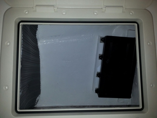 Under-berth side storage now lined with closed cell foam on the foam side and coated with SC1000 on the rest. Battery tray is where one of the house batteries will go (battery against berth bulkhead)