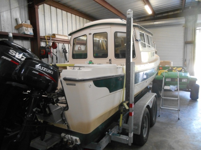 Heavy duty vertical guides.  These won't bend.  Wind, waves, current no problem.  Steer the bow between these guides, steer the stern around, and power up to the winch.  They solved my loading problems.