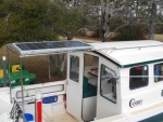 If I bring the dinghy, the SP mounts over the cockpit, and acts as a dodger.  As I seldom use the camperback, this is where I will keep it.  It is narrow enough to not get in the way when going forward, boarding, or fishing. Later on I rethought this idea and moved the dinghy to this rack and left the sps on the roof. Final configuration is one solar panel on standoffs mid roof, dinghy in a case on the cockpit deck, 110 volt inflator running off the invertor.  I can inflate and launch the dinghy over the side in 10 minutes.