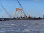 The river is very industrial between the Gulf and the I 10 bridge. Port Arther, Orange, and (on the adjoining Neches River) Beaumont, Texas all add to the heavy traffic.