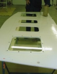 June 2005:  Glass & painted frames being installed on upper bulkhead.