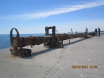 This is the 200 year old mast caught in a fishing net off the tip of Long Point(Lake Erie) in early May 2015. It is 77 feet long - 15 to 20 inches in dia. - solid pine and weighing(waterlogged) between 15 and 20 tons. This is the day it was put back in the water as ordered by the Ontario government.