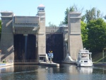 P1020253 notice upper tub to the right. we are going in the lower one on the right. In the tub with us were three 40' boats and little us. The lock was built in 1909 when men were men and still works like a champ