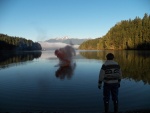 Toss out in the water.  IT IS IN THE SHADE!!  Once the smoke rose high enough for the sun to hit it, it was bright orange.  But smoke flares obviously do have their limitations.