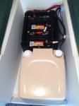 Auxiliary Battery Box located forward of porta potty.