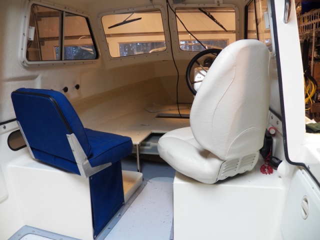 The width of the original seat hit the throttle at the bottom and the back of the seat hit the cabin side.  Also, although the original seat was shorter, the back thickness and angle interfered with the wheel when turned 180, requiring the seat to be more upright if turned around.