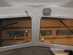 Here is the wiring placed in cream colored conduit running right up the side of the window.  I used this on the transom to cover the depth sounder cable and thought I would try it here. 