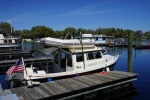 Thisaway at the end of the trip--dinghy on top of the cabin house, via davit system.