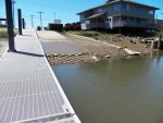 Well, there is the boat ramp.  This is a minus 1 foot tide.  But the super slippery mud is much higher.  You will need a tow truck with a winch to get back up if you use it at other than high tide.