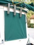 Sunbrella cabin window covers for privacy and shade. Also keep the windows clean. These covers snap to the mesh shades under them.