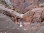 Oak Canyon waterfall.  Waterfall is under arch.  In the past we didn't know there was a arch here & it was only after the rain did we see ihe water flowing under instead of over.