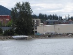 The transients apparently like to beach their sailboats along the waterfront because the following day there was another one just like this! If you look closely there are campers in tents on the beach. And that's NMI in the next building to the right.