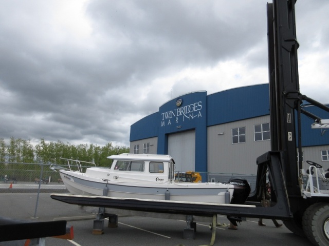 2017-04-18 Setting boat onto work stand to remove the straps, then it will be lifted onto storage rack inside the building