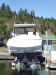 Bayliner on precarious boat lift in the slip behind me.