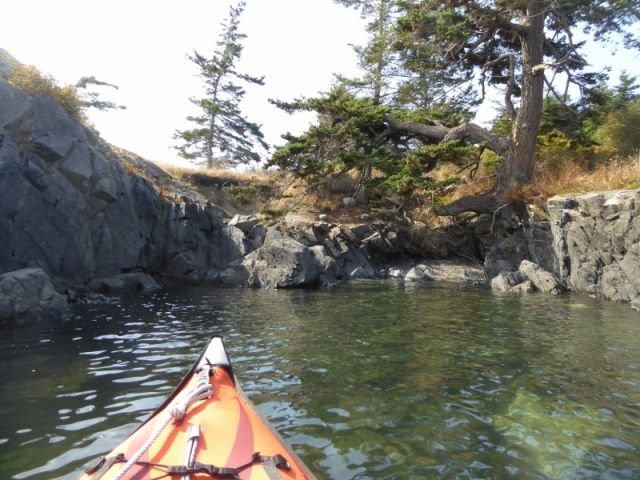 Exploring the various rock formations on the outside of Watmough bay