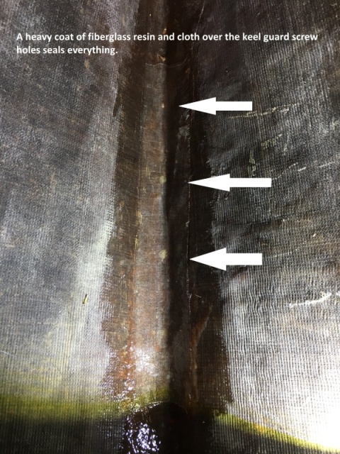 Fiberglassing over keel guard screws.
