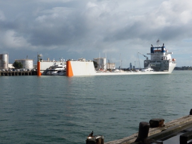 Auckland had some interesting recreational boats, but this ship was more interesting.  You drive your mega-yacht in through the stern, adjust the submerged hydraulic weighs, raise the ship's hull, and have your ocean going yacht delivered without the inconvenience of having to actually cross the ocean under your own power.  What a concept.  