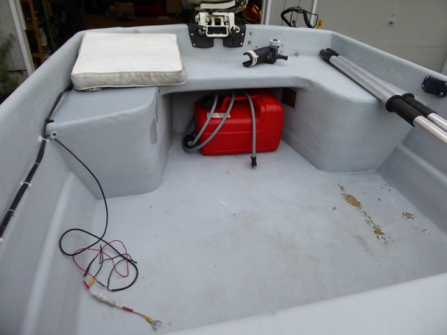 Needs some touch-up interior paint. You can see a couple of test patches I did on the starboard side rear seat with Interlux Interdeck.  Looks pretty good, Think I'll do the whole thing. Wires for fish finder installed by previous owner. Long shaft transom!
