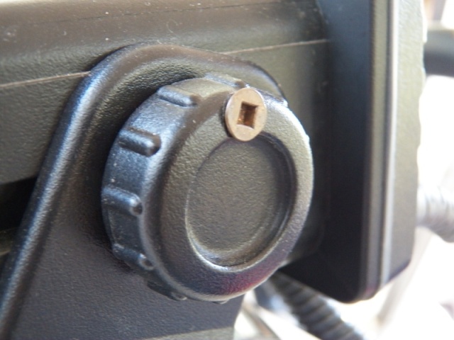 Like most radios, mine just has twist knobs to hold it to the bracket.  I used the right length screw to drill a hole through the knob and into the bracket (and not into the radio).  The bracket can't be removed with the radio in place.  A thief would need to figure out the problem and have a short-shaft #2 square drive screwdriver.  