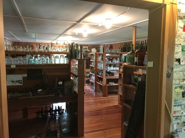 A room of old bottles at Billy Procter Museum near Echo Bay