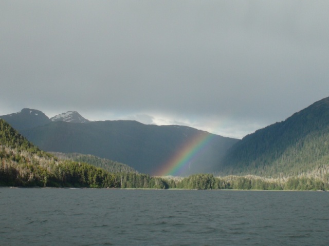 Waterfall Cove, Slocum Arm of Khaz Bay, West side of Chichagof Island.  White streak in rainbow is 500 ft waterfall & reason for the coves name