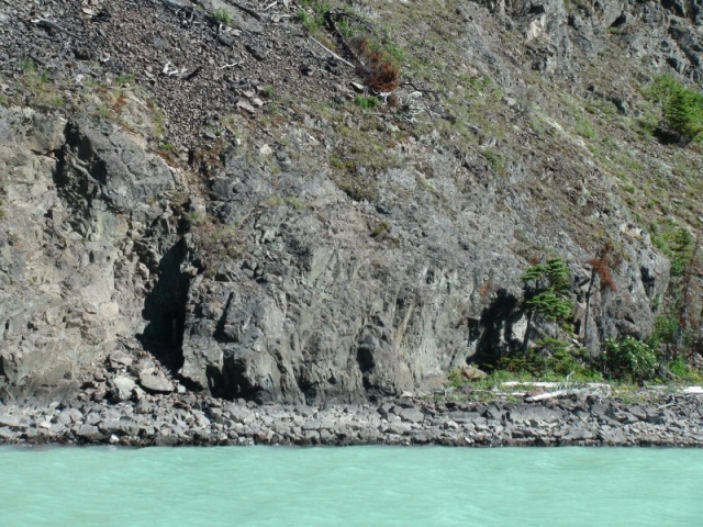 The mine shaft is in the dark shadow area.