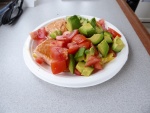 Salmon, eggs, tomatoes, and avocado for breakfast.  A strange mix.