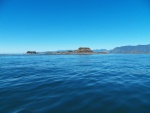 Outlying islets in front of the Bunsbys with the Brooks Peninsula in the background.