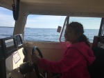 Mia at the helm