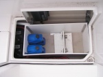 Added liner inside portside cock pit storage to protect wiring, etc. Shown is outboard motor mount for swim step