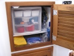 Storage under sink: added shelf and attached 3 drawer unit for untensils