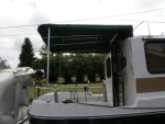 Canvas canopy over rigid stainless with bug netting for side panels