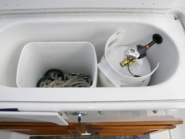 Converted baitwell to propane locker with venting and storage