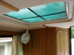 Glued sun shade material to top of screens; removed light and added a fan