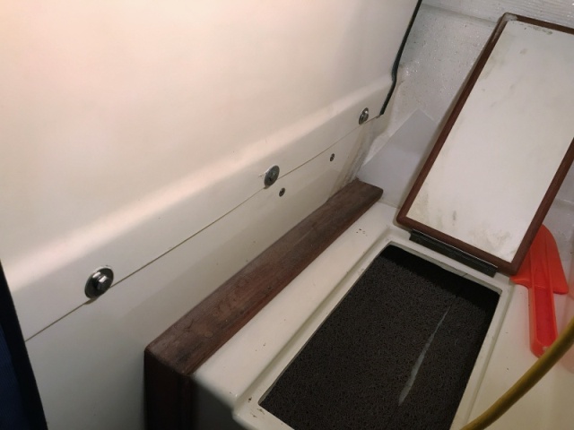 The Smart pump is held by 4 screws thru the bulkhead. 2 at the bottom of the bulkhead just above the foot compartment door, the other two below the door.