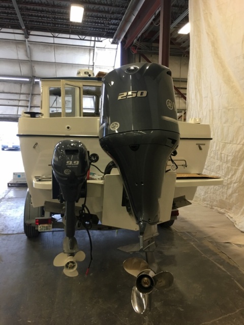 1984 refitted w/ Outboard bracket and kicker. Originally these were I/O boats.