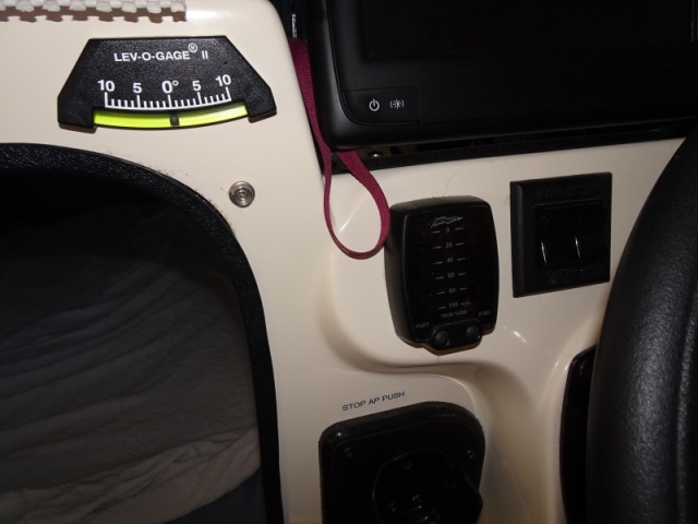 athwartship level gauge (heel or roll) display for auto retract trim tabs, and trim tab switch