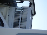 Window air condition 5000 'BTU, note handles for hoisting from inside.  There is a block and tackle system which uses the same spreader bar that is used for the dinghy and hooks onto these handles, making putting the AC unit into the window a one person activity.