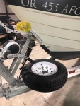 Spare tire used as stand for winching in boat.