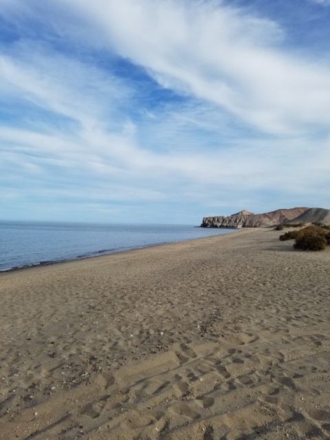 The beach at San Luis Gonzaga, Papa Fernandez's beach camp, typically flat calm, lake like, Sea of Cortez unless of one of the occasional northers is blowing. January weather today mid 70s.