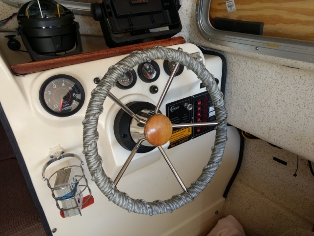 Then I pulled this destroyer wheel from the fishing boat, wrapped it with some 550 Paracord, and installed it in the Dory. Nice little update from the 